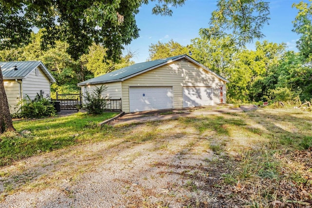 garage featuring a yard