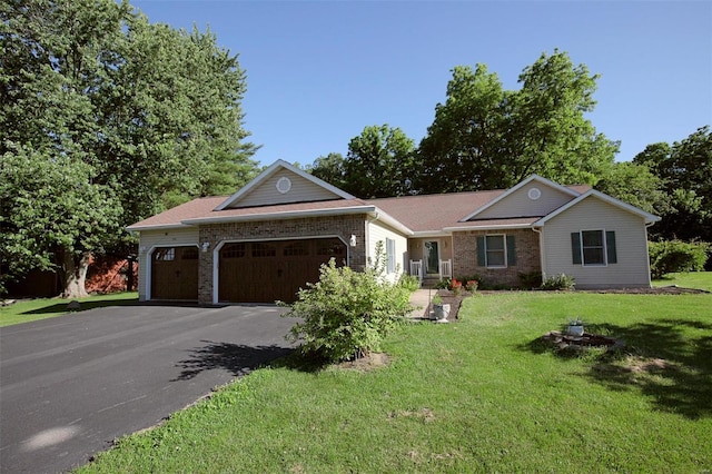 ranch-style home featuring a front yard and a garage