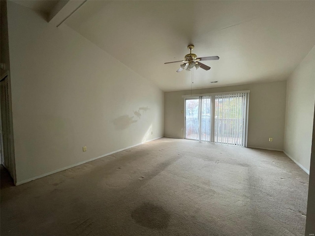 unfurnished room with ceiling fan, light colored carpet, and lofted ceiling with beams