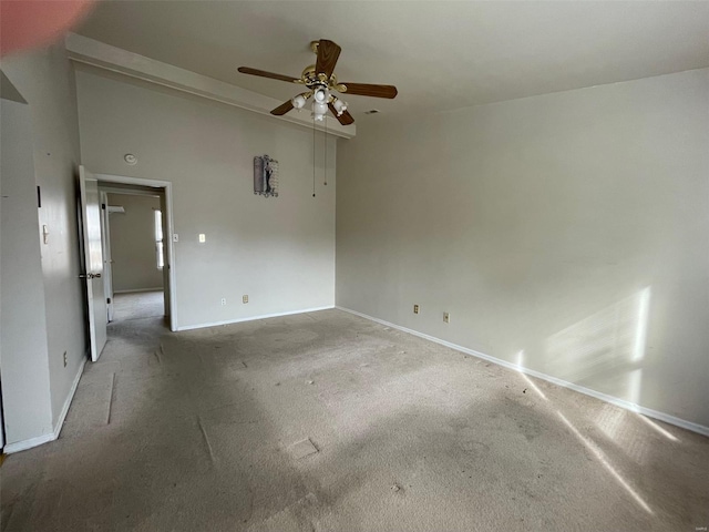 spare room featuring ceiling fan and carpet floors