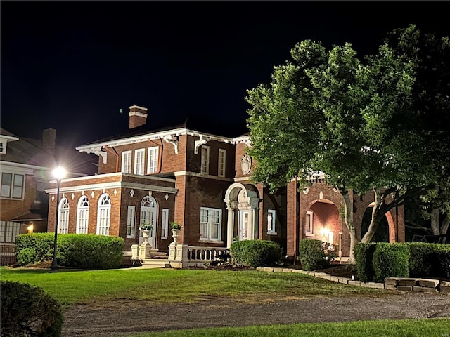 italianate house with a yard