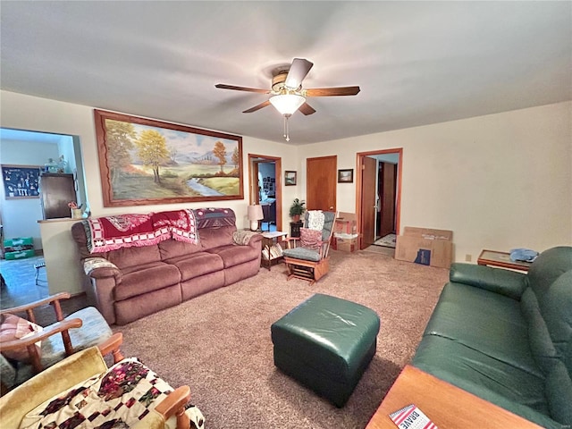 living room featuring carpet flooring and ceiling fan