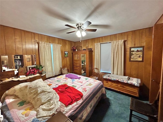 bedroom featuring dark carpet and ceiling fan