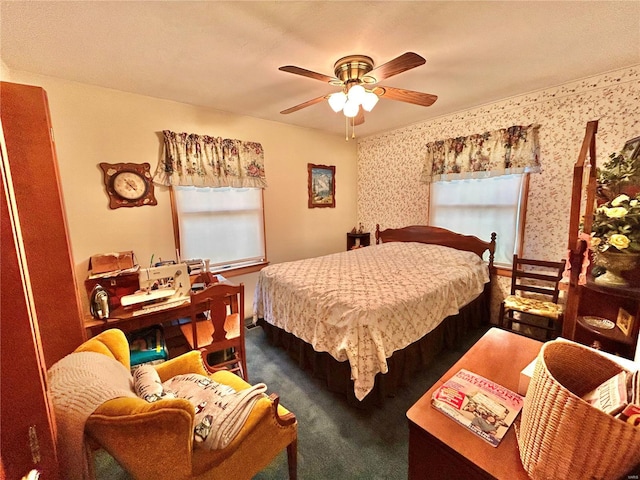 bedroom featuring multiple windows, ceiling fan, and carpet floors