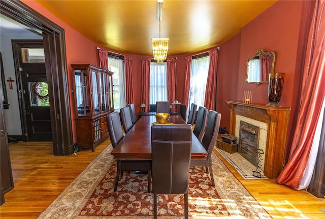 dining room featuring wood-type flooring and a notable chandelier