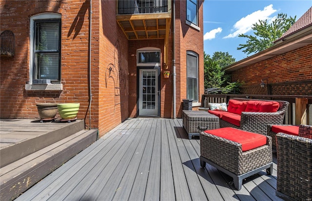 wooden deck with an outdoor hangout area