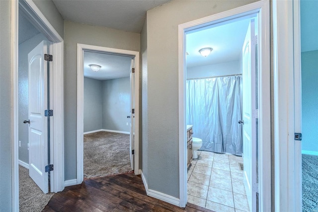 hallway featuring tile floors