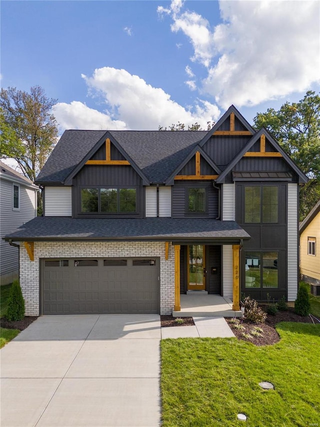 view of front facade featuring a front yard and a garage