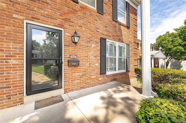 property entrance with a patio area