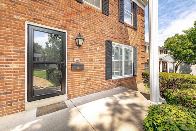 entrance to property featuring a patio area