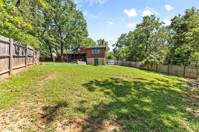 view of yard with a fenced backyard