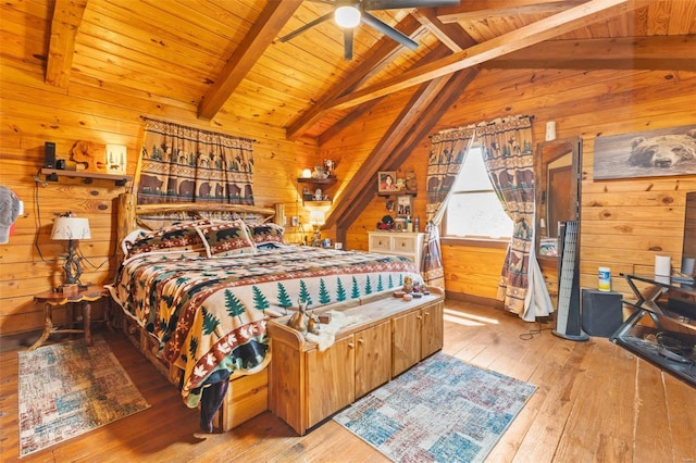 bedroom with wood ceiling, wood-type flooring, vaulted ceiling with beams, and wooden walls