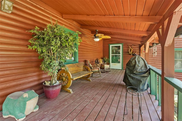 wooden terrace with ceiling fan and grilling area