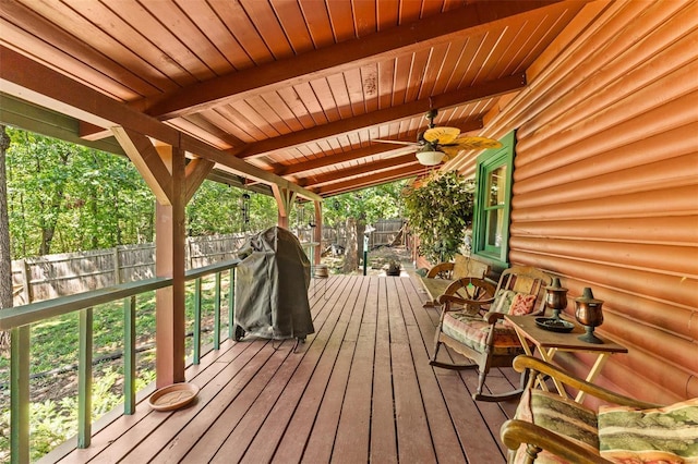 deck featuring a fenced backyard and ceiling fan