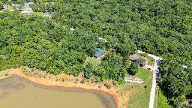 aerial view with a water view and a view of trees