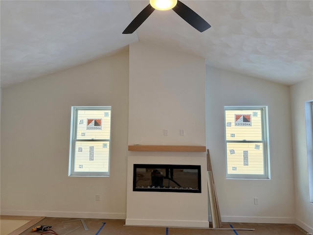 unfurnished living room with tile patterned floors, vaulted ceiling, and ceiling fan