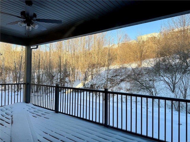 snow covered deck with ceiling fan