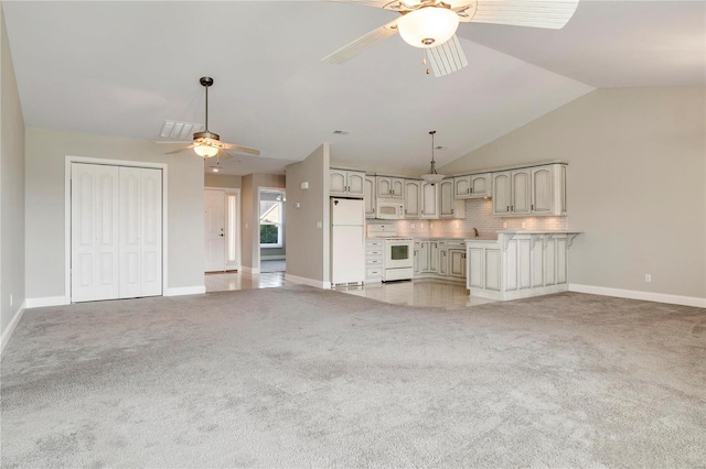 unfurnished living room featuring ceiling fan, sink, lofted ceiling, and light carpet