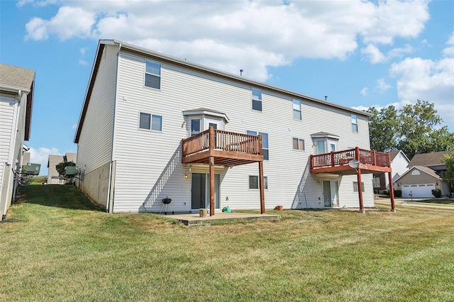 back of property with a balcony and a lawn