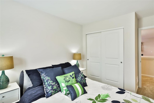 carpeted bedroom with a closet