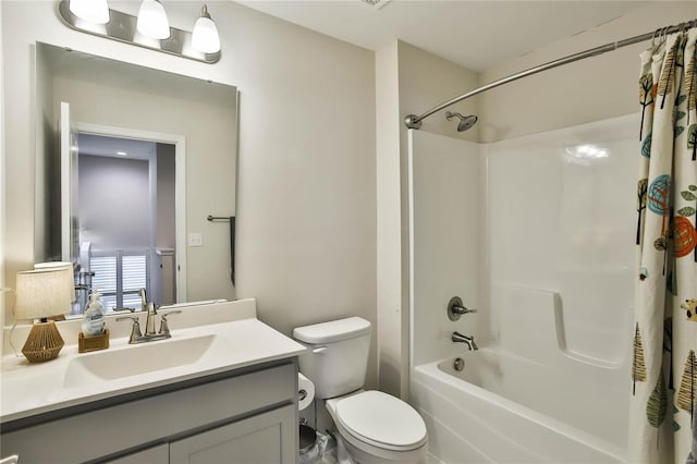 full bathroom with vanity, toilet, and shower / bath combo