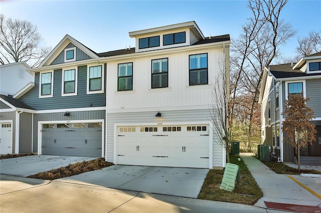 multi unit property with a garage and central AC unit