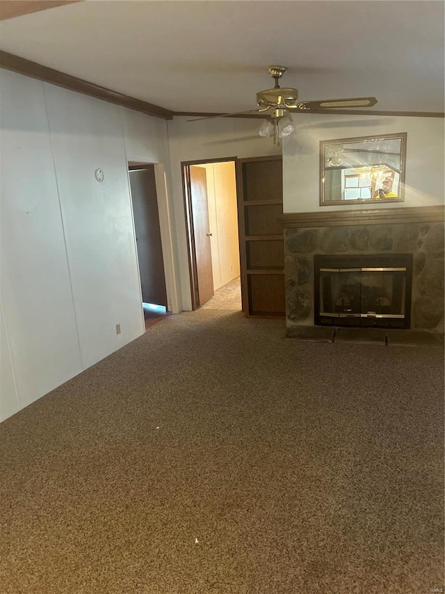 unfurnished living room featuring carpet, crown molding, and ceiling fan