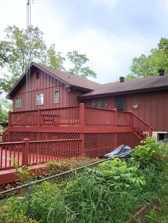 view of side of home with a deck