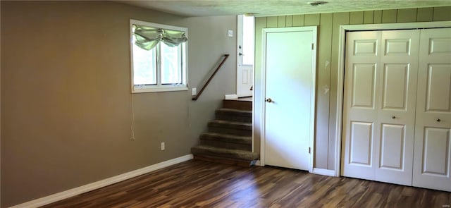 staircase featuring hardwood / wood-style flooring