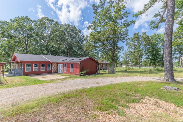 ranch-style house with a front lawn