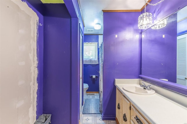 bathroom featuring toilet, tile patterned floors, and vanity