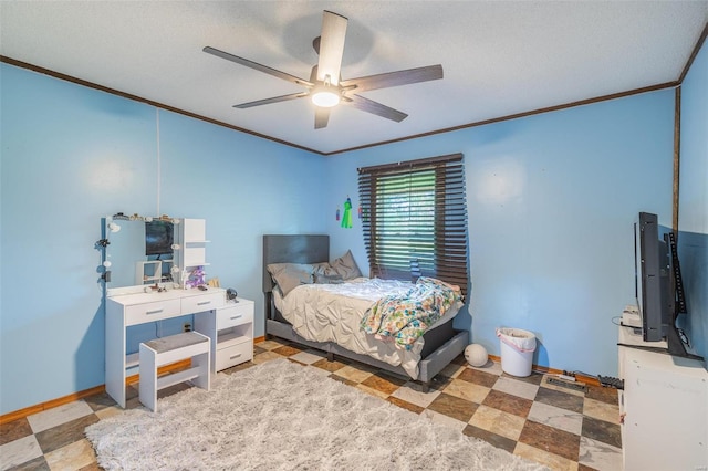 bedroom featuring crown molding, baseboards, and tile patterned floors