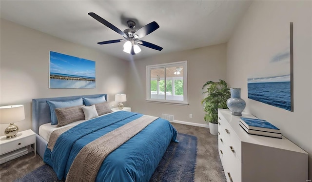 bedroom featuring ceiling fan and dark colored carpet