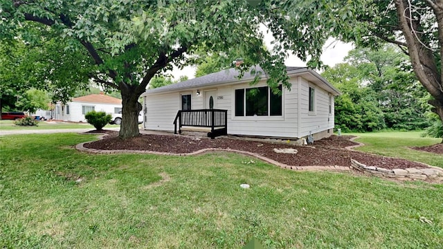 ranch-style house with a front lawn