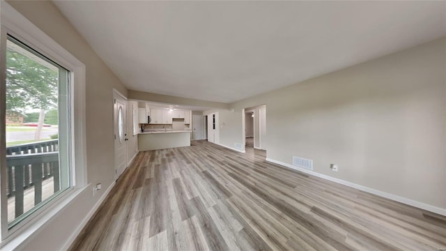 unfurnished living room with light wood-type flooring