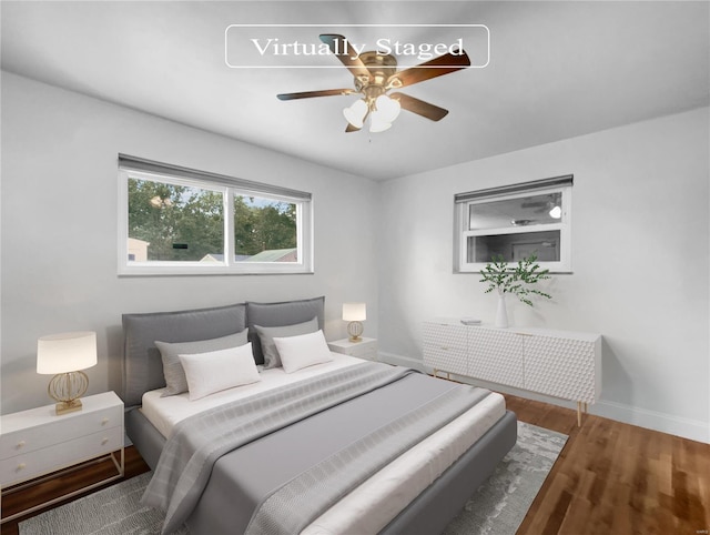 bedroom featuring wood-type flooring and ceiling fan