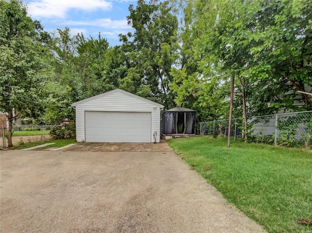 garage with a yard