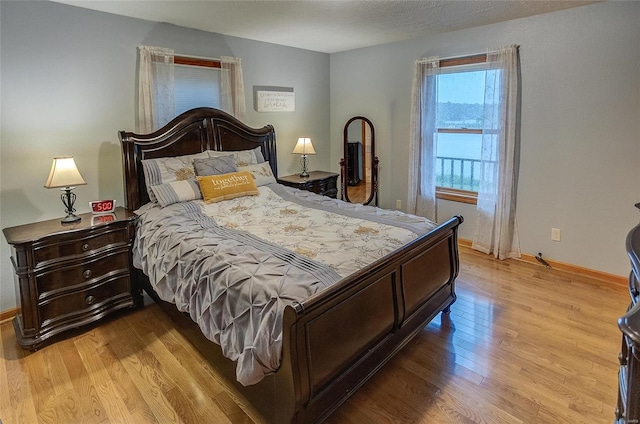 bedroom with light hardwood / wood-style floors