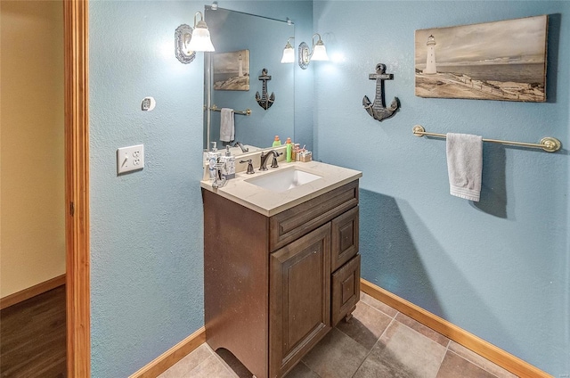 bathroom with tile patterned floors and vanity