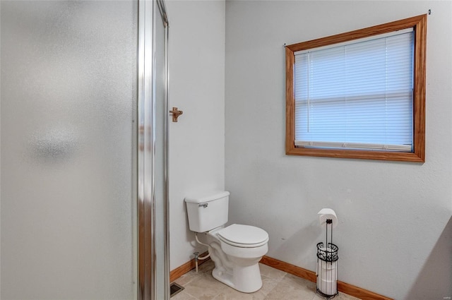 bathroom featuring tile patterned floors and toilet