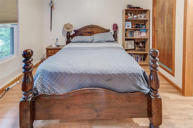 bedroom with light wood-type flooring