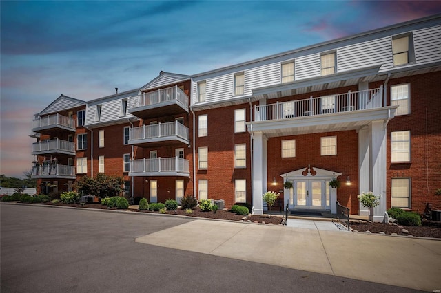 outdoor building at dusk featuring central AC