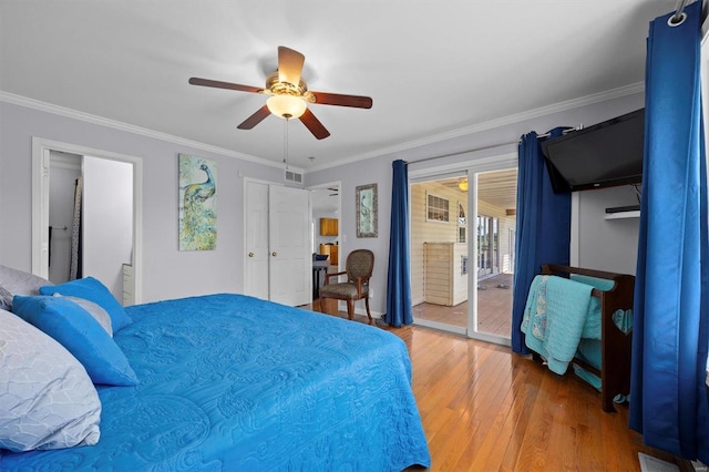 bedroom with hardwood / wood-style flooring, ceiling fan, ornamental molding, and access to exterior