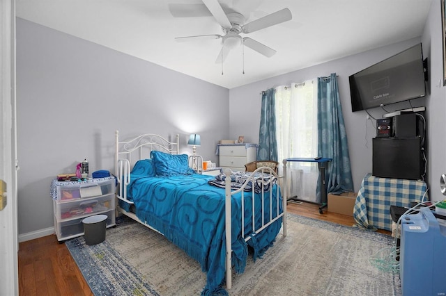 bedroom with hardwood / wood-style floors and ceiling fan