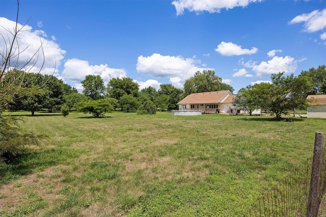 view of yard with a rural view