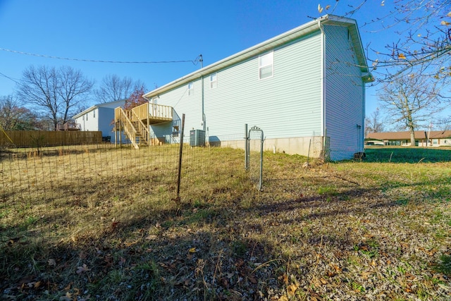 exterior space featuring central AC and a wooden deck