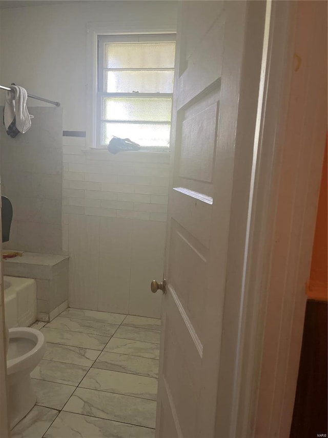 bathroom featuring tile patterned floors and toilet