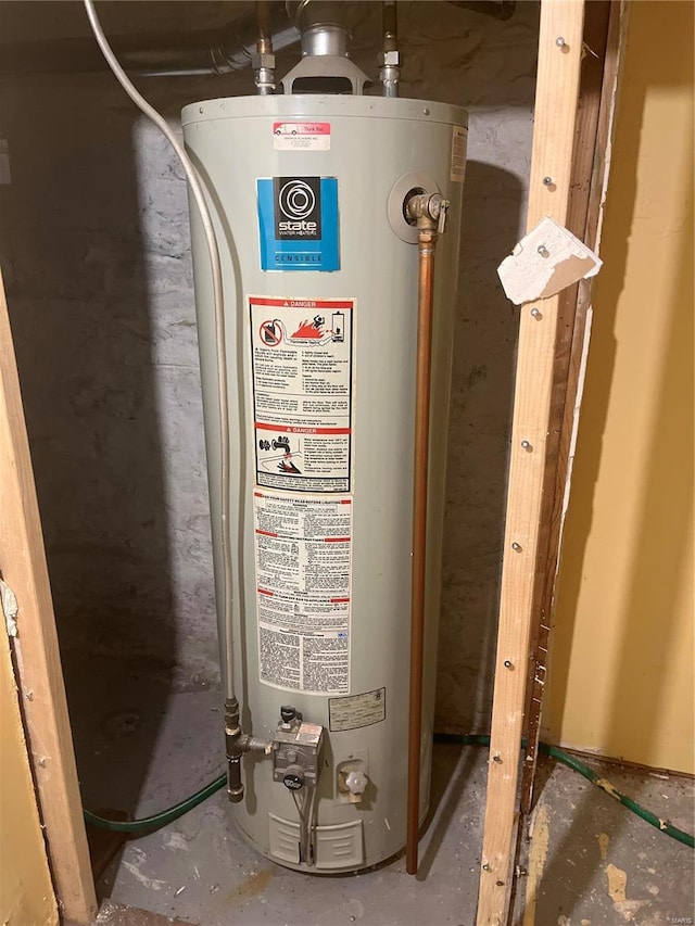 utility room featuring gas water heater