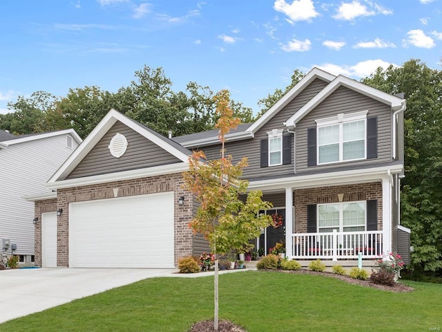 craftsman inspired home featuring covered porch, a garage, and a front lawn