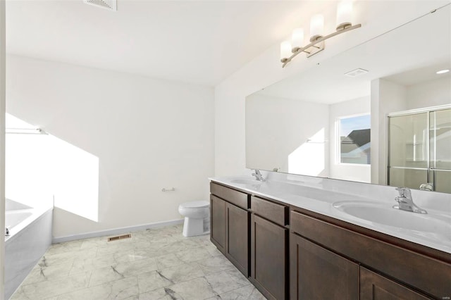 full bathroom featuring vanity, separate shower and tub, and toilet